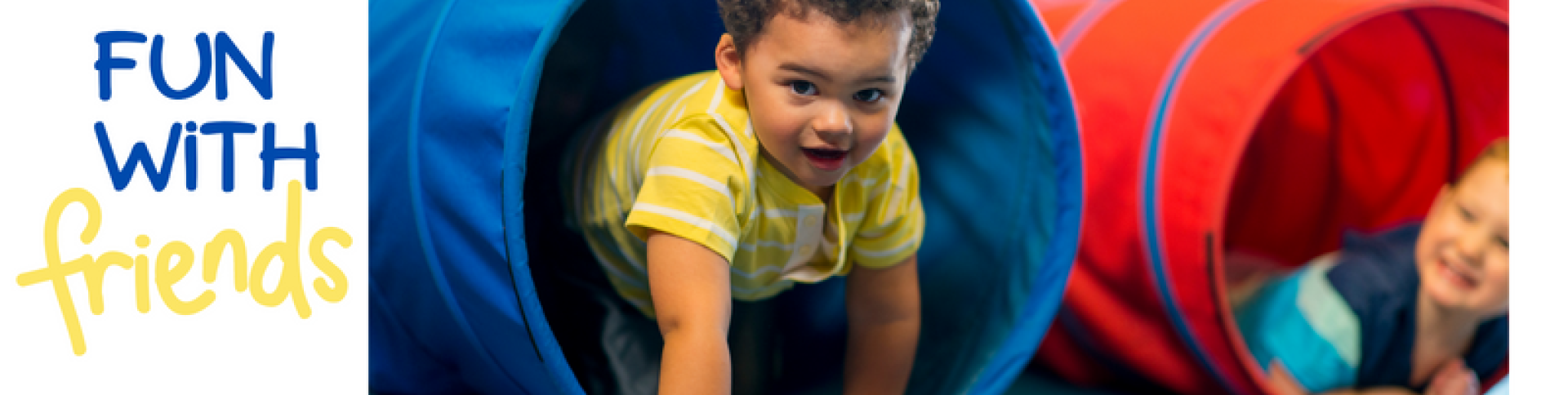 toddlers crawling through a play tunnel