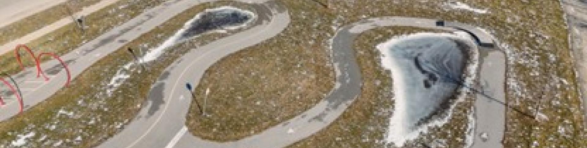 Drone view of park in early spring with ponds and cycle tracks