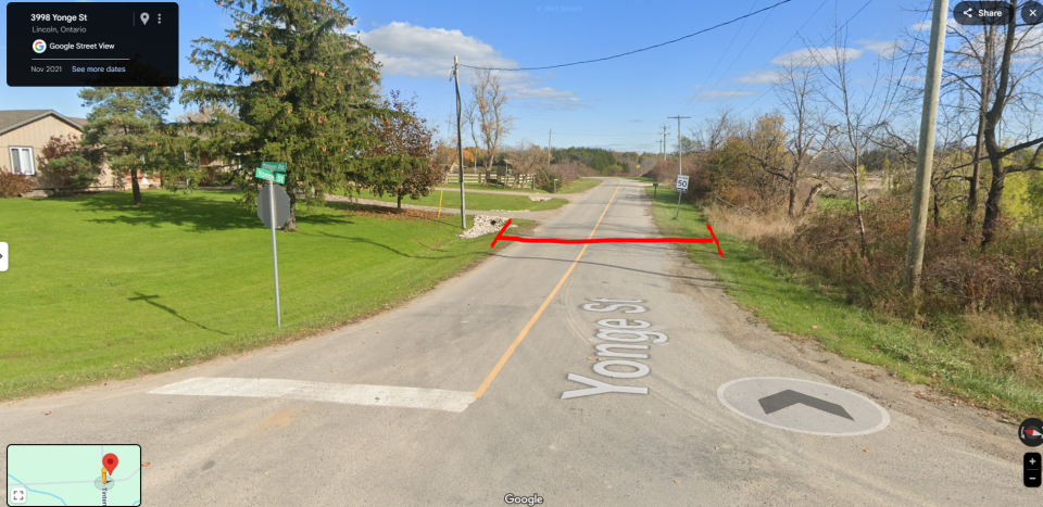 Street view of road with red line marking closure.