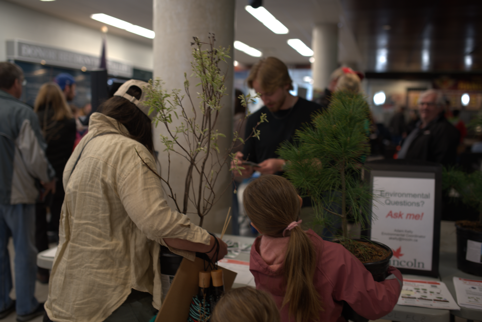 community members holding trees